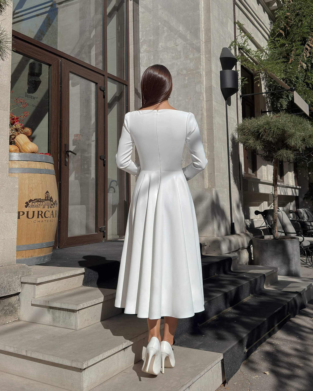 White midi dress with long sleeves made of crepe for civil and religious wedding