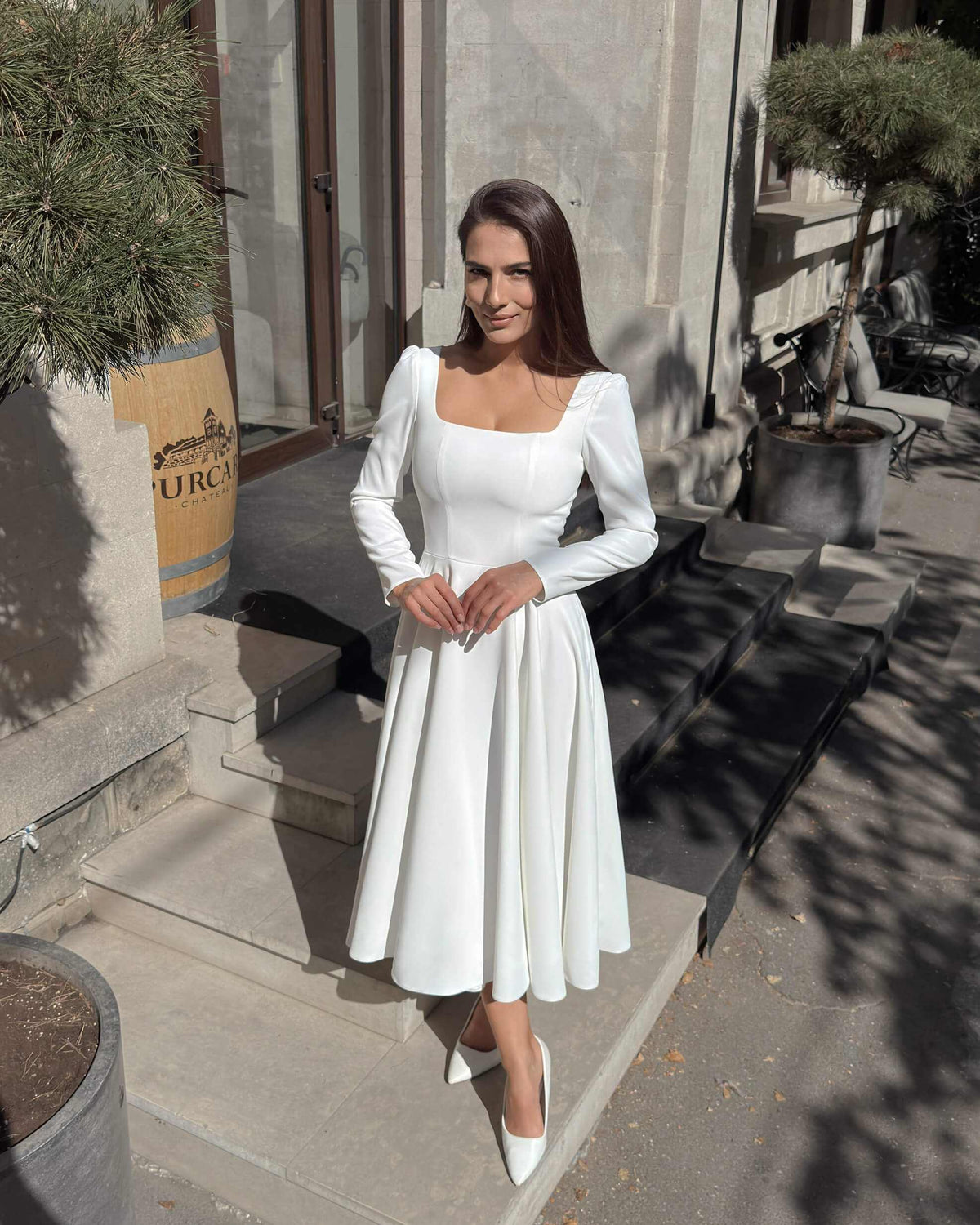 White midi dress with long sleeves made of crepe for civil and religious wedding